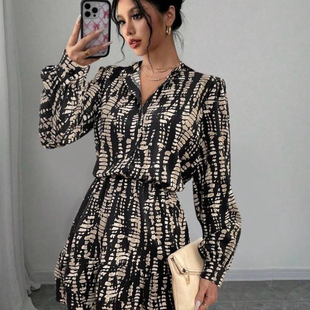 Elegant Black and Cream Patterned Dress